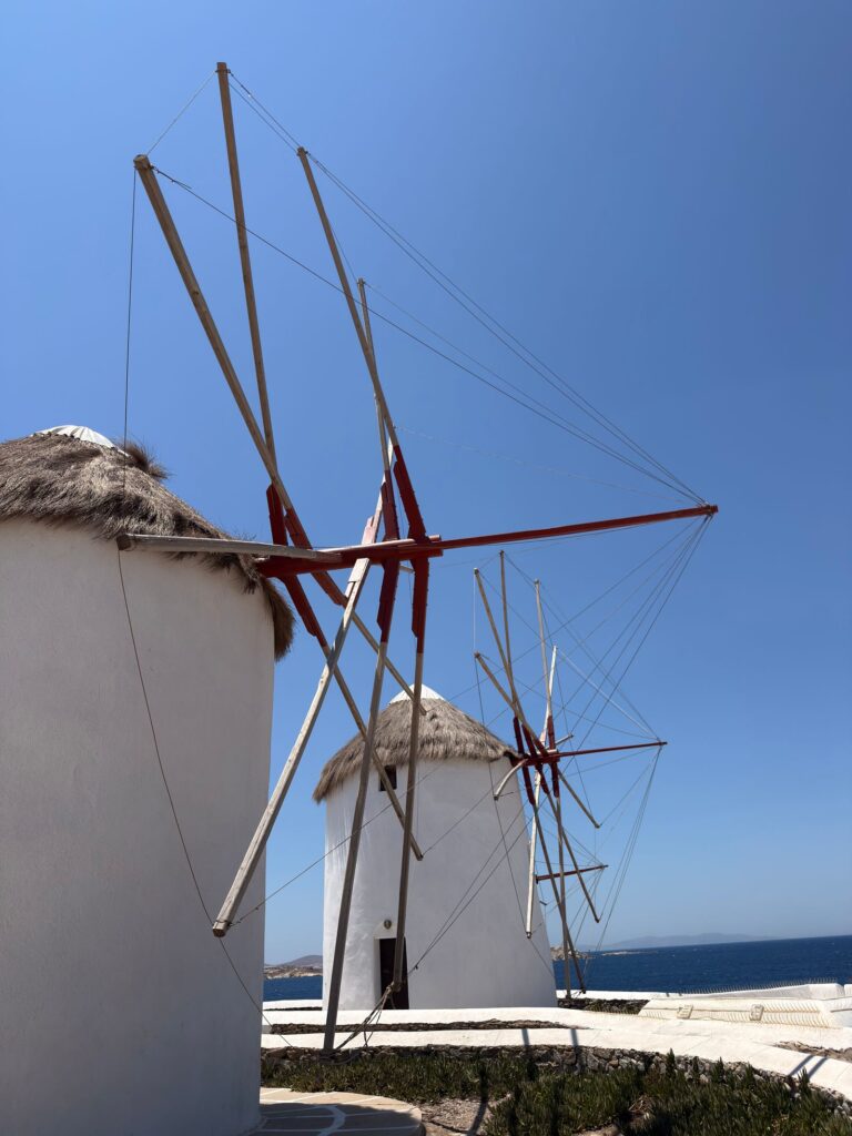 Aerial view of Mykonos town, windmills and the sea